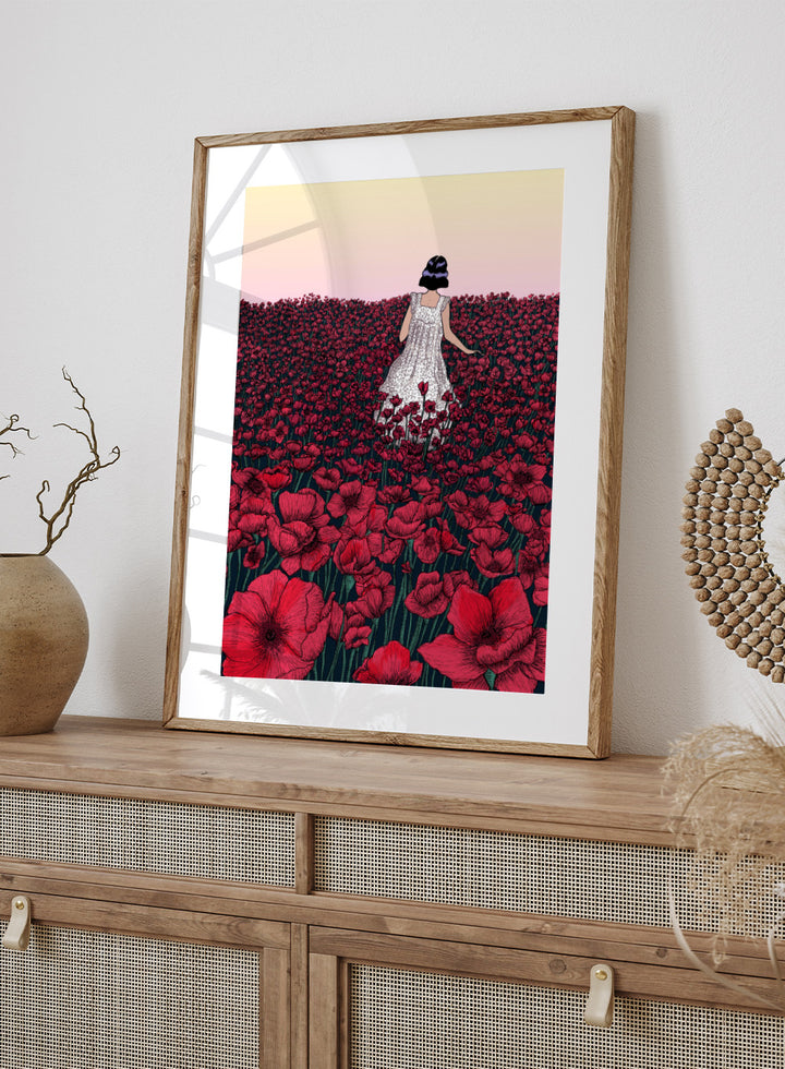 Woman in a white dress standing in a field of red flowers with a gradient sky. Field of Poppies by E.C. Mazur is an officially licensed art print featuring a woman standing in a red poppy field. Illustrated landscape wall poster.