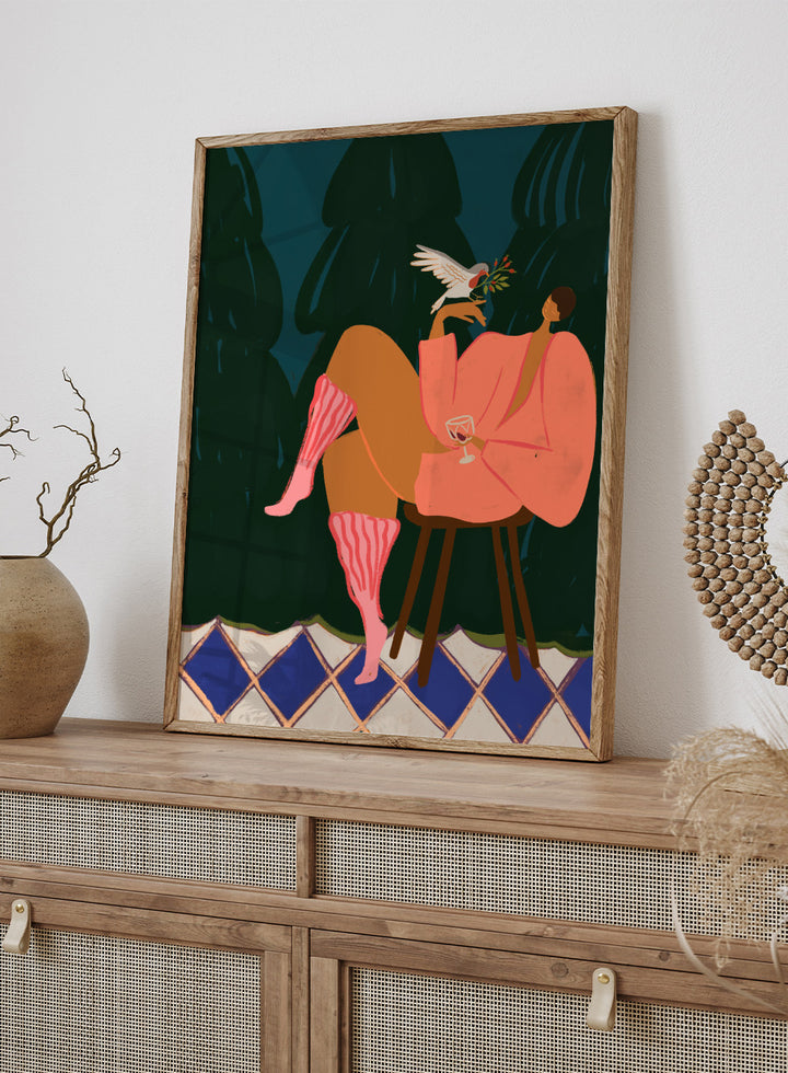 Illustration of a person in a pink dress sitting on a stool with a glass of wine, holding a dove with an olive branch. A Lil Birdy Told Me by Arty Guava is a modern woman art print with a bird, pink robe, and bold color. Officially licensed wall poster.