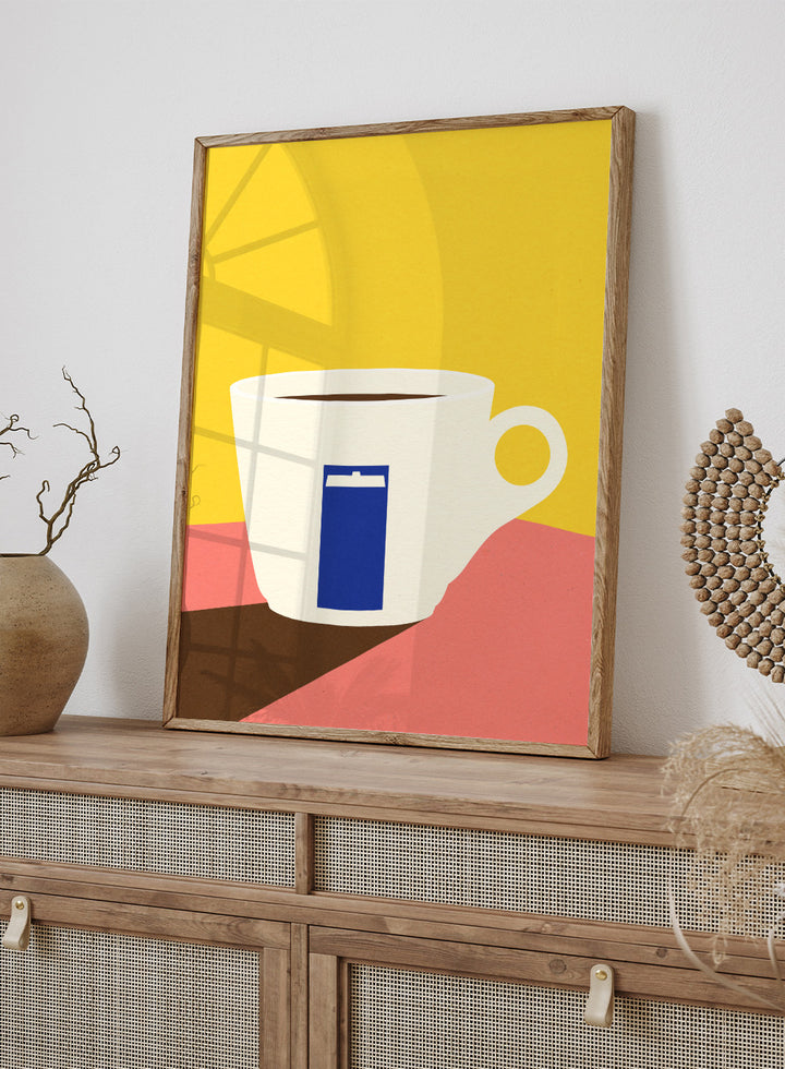 White coffee cup with a blue book design on a yellow and pink background. Tazza by Rosi Feist is a minimalist modern art print of a coffee cup in bold Bauhaus-inspired color blocks. Officially licensed fine art poster with framing.