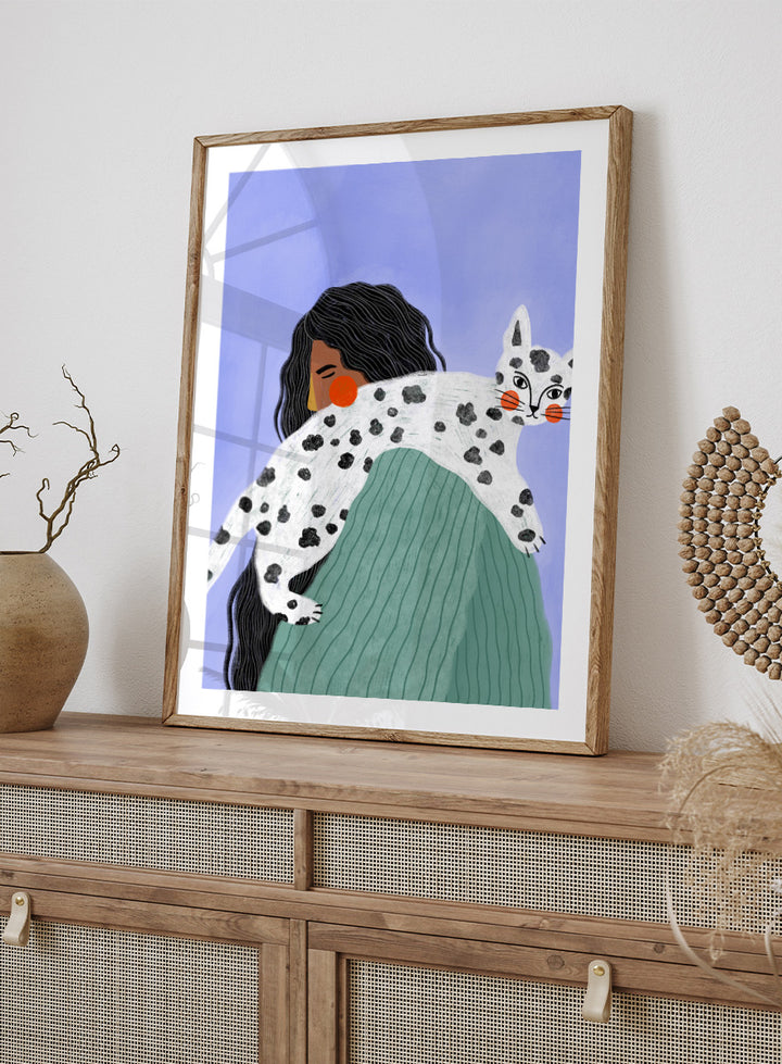 A framed art print featuring a stylized illustration of a woman with long black hair carrying a white cat with black spots over her shoulder, set against a lavender background. Woman and Spotted Cat by Bea Müller animal art print featuring a woman carrying a playful spotted cat, perfect for modern cat lover and pet decor.