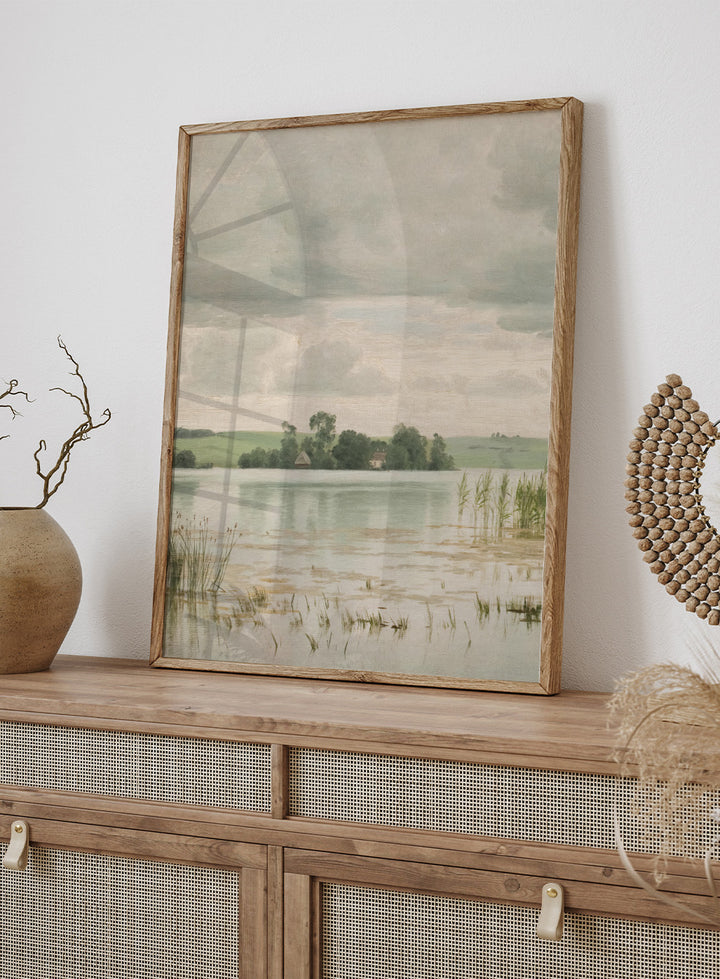 Featuring the original Vilhelm Groth's Artwork Esrom sø (Esrum Lake), this dark moody European vintage neutral autumn river lake landscape oil painting wall art print showcases a classic rustic moody antique style that is perfect for any boho or modern farmhouse space with muted or neutral fall colors. 