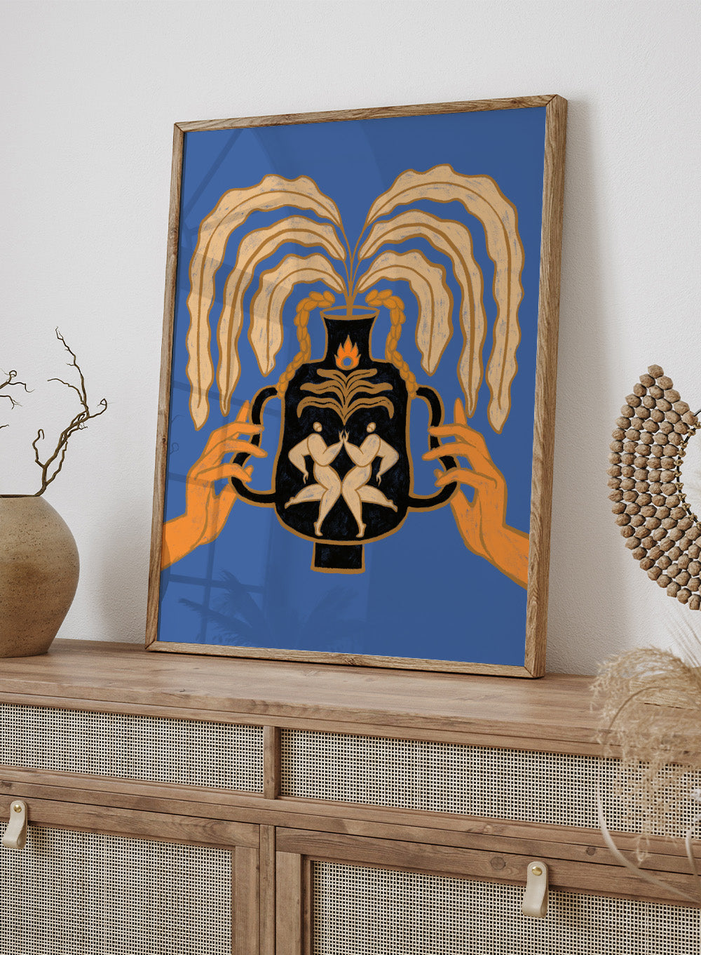 Decorative urn with hands holding it against a blue background. Vessel Collection: Let’s Meet Again by Arty Guava art print, modern vase wall poster with symbolic figures, contemporary blue minimalist illustration.