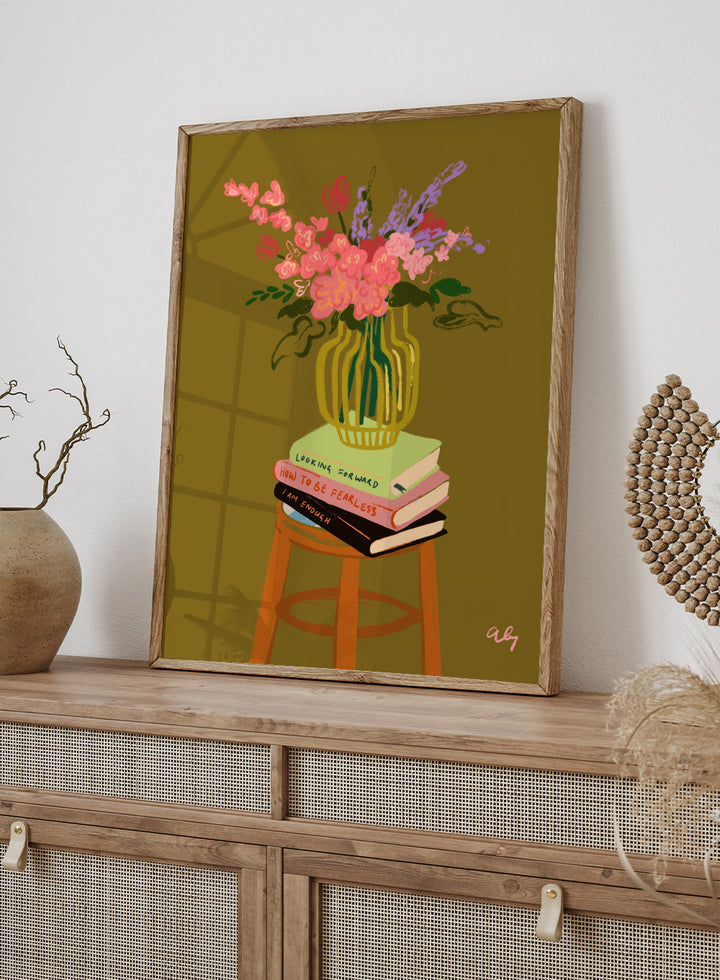 Vase with flowers on a stack of books on a stool against a green background. Floral Vase by Arty Guava is a modern flower still life art print with a striped vase and book stack. Officially licensed wall poster.