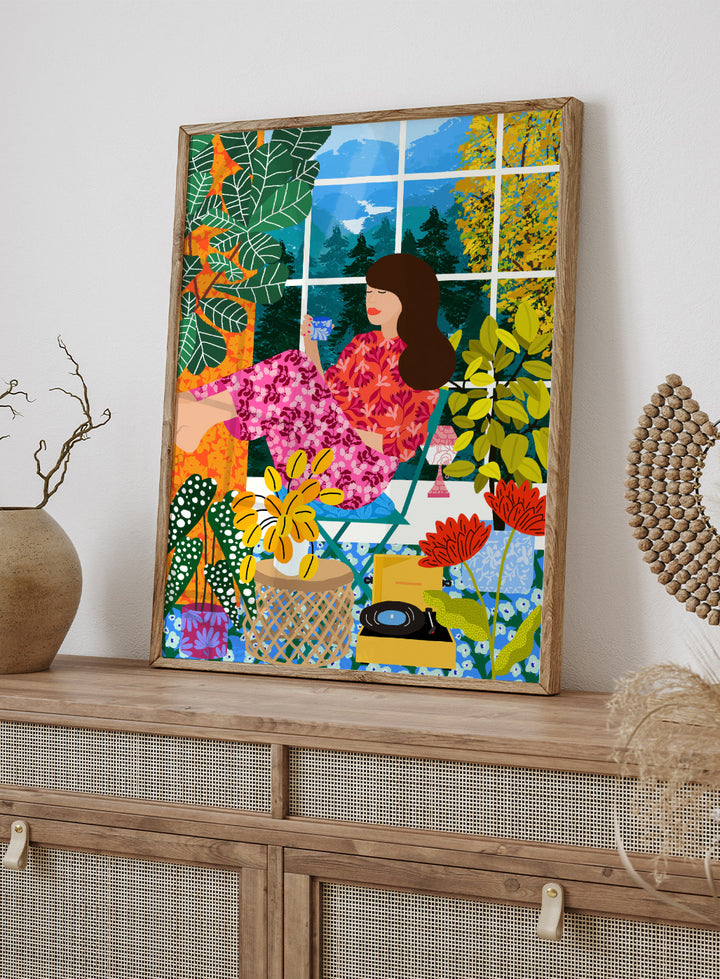 Illustration of a woman sitting by a window with a cup, surrounded by plants and flowers. Listening To the Sound of Nature by Rafaela Mascaro fine art print featuring woman by window, botanical interior, colorful plants, modern contemporary wall art poster.