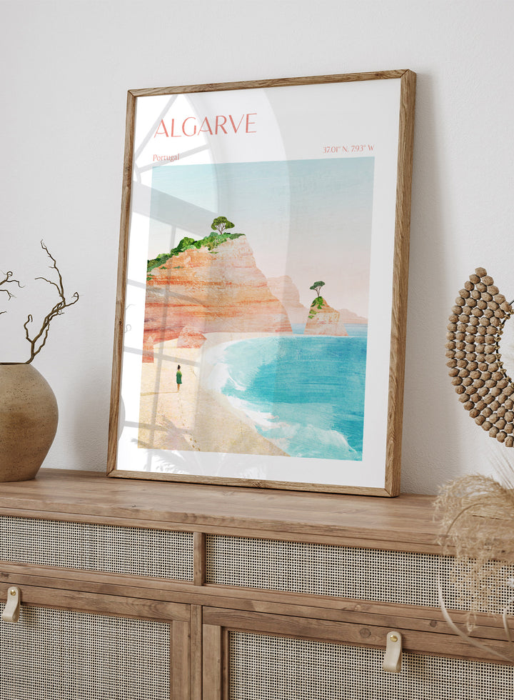 Illustration of a beach scene with cliffs and a person standing on the shore, labeled 'Algarve, Portugal'. Algarve Coastal Walk by Longwayhome is a minimalist coastal landscape art print featuring Portugal cliffs, turquoise ocean scenery, and modern travel inspired design.
