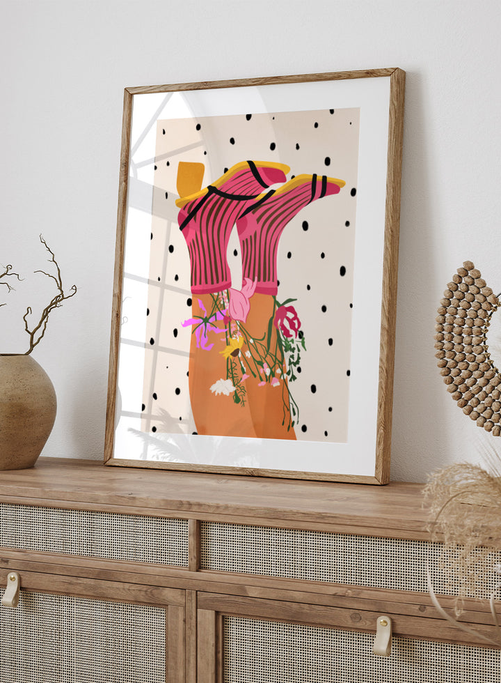 Illustration of a person wearing a pink top with floral accessories on a polka dot background. Floral Step Delight by Gauri Mokate is an officially licensed art print featuring a fashion-inspired illustration with florals, bold colors, and modern graphic style.