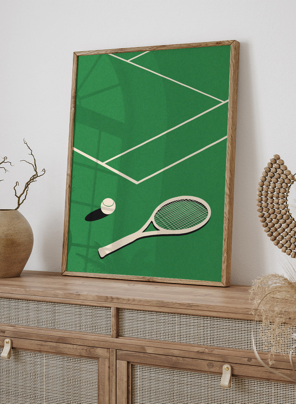 Tennis racket and ball on a green court with white lines. Lawn Tennis Club by Rosi Feist is a minimalist tennis court art print with modern Bauhaus design. Officially licensed fine art poster with framing.