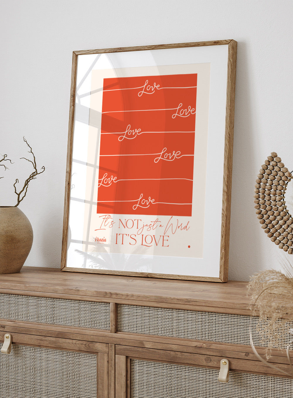 Red poster with 'Love' text and a quote on an orange background. About Love. One Word by Maria Galybina features bold typography and warm coral tones. Modern love quote art print and contemporary wall poster.