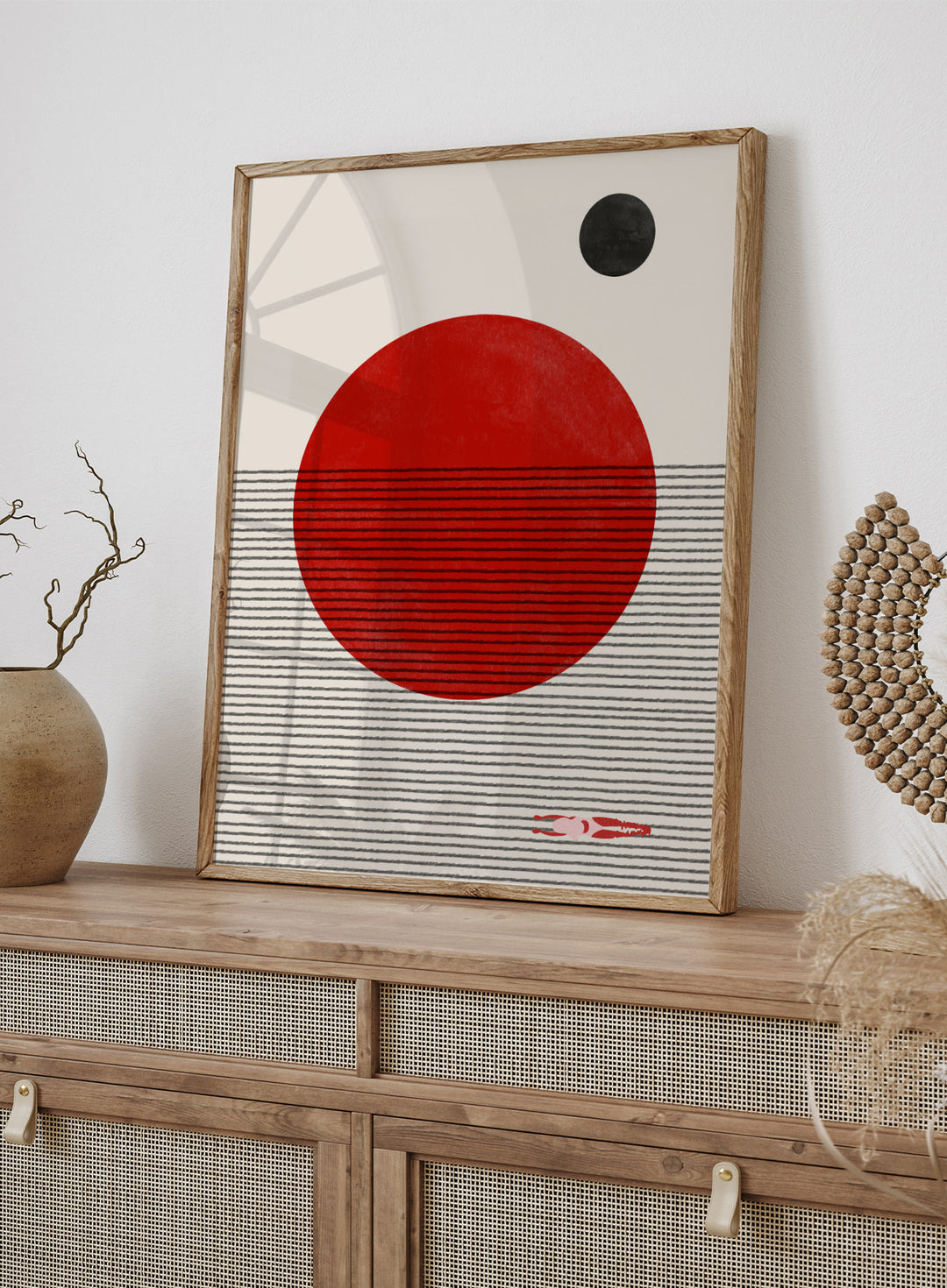 Abstract design with a red circle, black dot, and striped pattern on a beige background. Floating Horizons by The MIUUS Studio is a minimalist abstract art print and wall poster featuring geometric shapes, red sun, ocean lines, and swimmer detail.