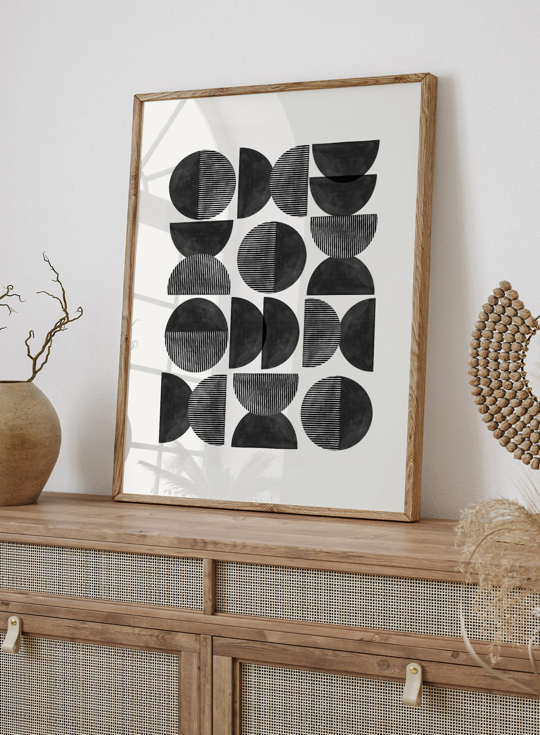 Geometric pattern of black semi-circles on a white background. Geometric Rhythm by The MIUUS Studio is a minimalist abstract art print and wall poster featuring repeating geometric shapes, black and white tones, and modern striped textures.