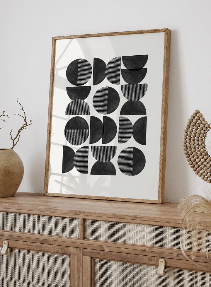 Geometric pattern of black semi-circles on a white background. Geometric Rhythm by The MIUUS Studio is a minimalist abstract art print and wall poster featuring repeating geometric shapes, black and white tones, and modern striped textures.