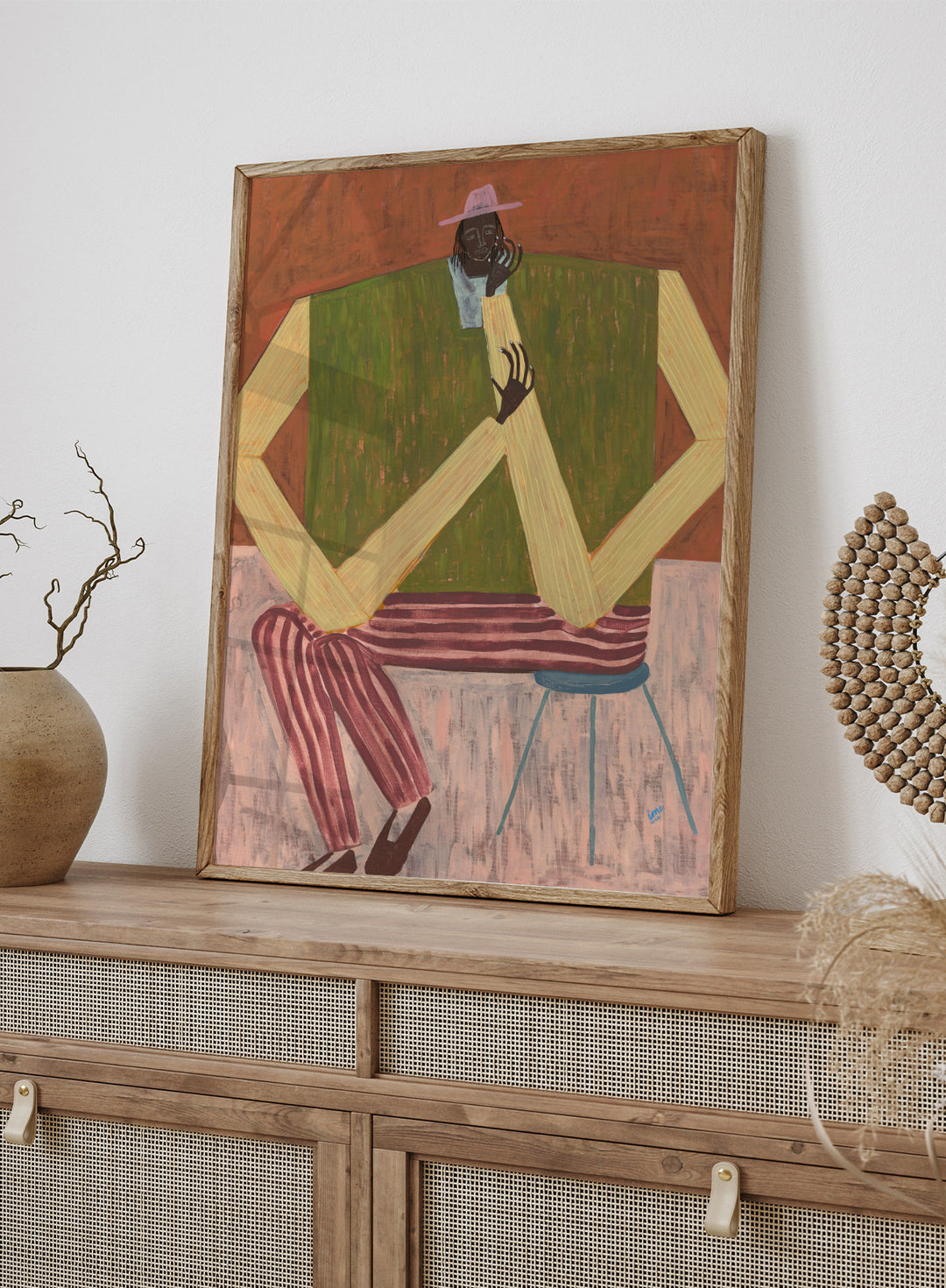 Surrealistic painting of a person sitting on a chair with geometric shapes and abstract design. Take a Moment by Studio IMO (Ibi Meier-Oruitemeka) is a modern figurative art print featuring a seated figure in a calm, reflective pose, designed as a contemporary wall art poster.