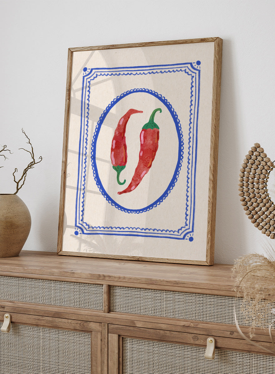 Spicy Chili Peppers by Katarzyna Gąsiorowska kitchen art print featuring red chilies in an ornate cobalt frame with vintage Mediterranean style.