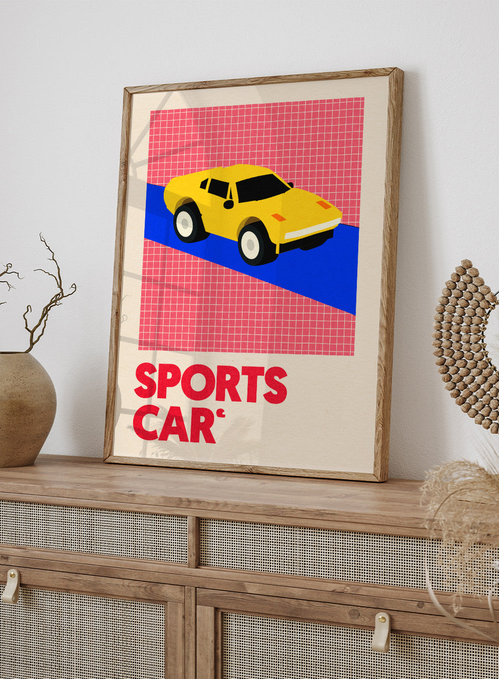 Yellow sports car on a red and blue geometric background with 'SPORTS CAR' text. Sports Car by Rosi Feist is a bold minimalist car art print featuring a bright yellow sports car and graphic typography. Officially licensed Bauhaus-inspired fine art poster with framing.