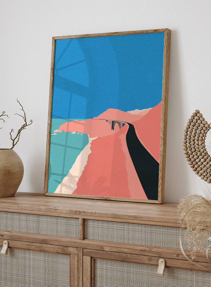 Artistic illustration of a coastal road with cliffs and blue sky. Pacific Coast Highway Big Sur by Rosi Feist is a modern minimalist landscape art print with bold color and Bauhaus-inspired graphic design. Officially licensed fine art poster with framing.