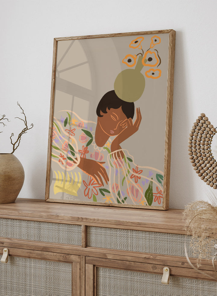 Illustration of a person with a flower on their head against a beige background. The Overthinker by Arty Guava is a modern woman illustration art print with soft florals and warm tones. Officially licensed wall poster with framing.