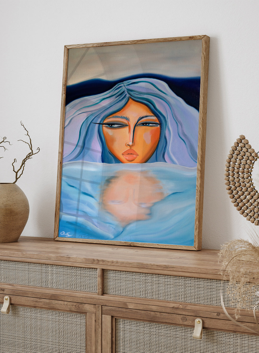 Artistic depiction of a woman with blue hair and a serene expression, surrounded by water. Ethereal Woman's Reflection by Amy Straley is a contemporary figurative art print featuring a feminine portrait, water reflection, and soft blue tones.