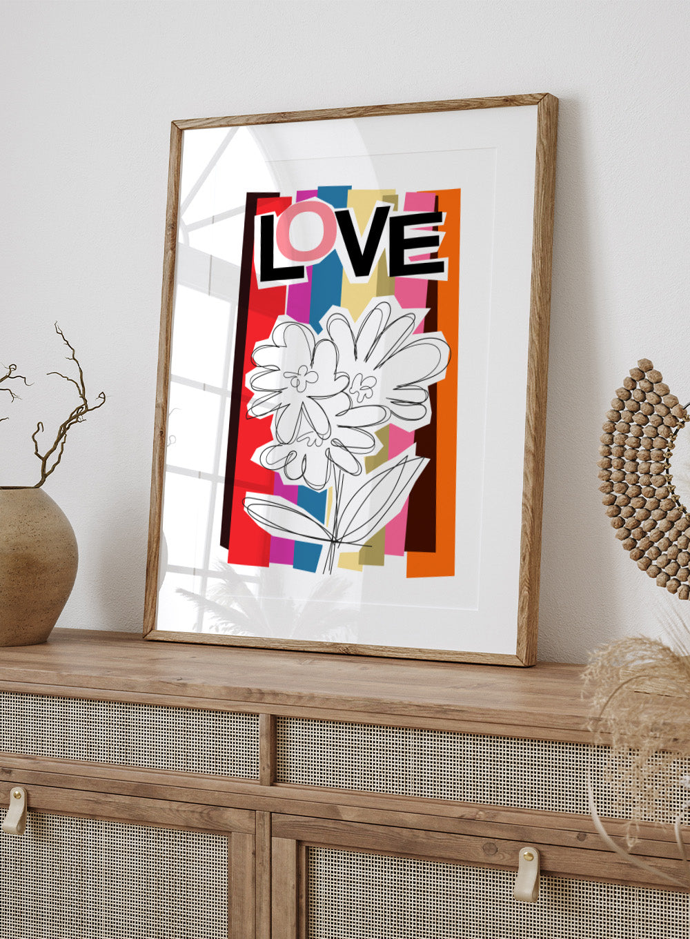 Colorful abstract design with flowers and the word 'LOVE' on a striped background. Scribble Flower by Frances Collett art print featuring a hand-drawn flower over bold colorful stripes with the word LOVE. Officially licensed wall poster with framing option.