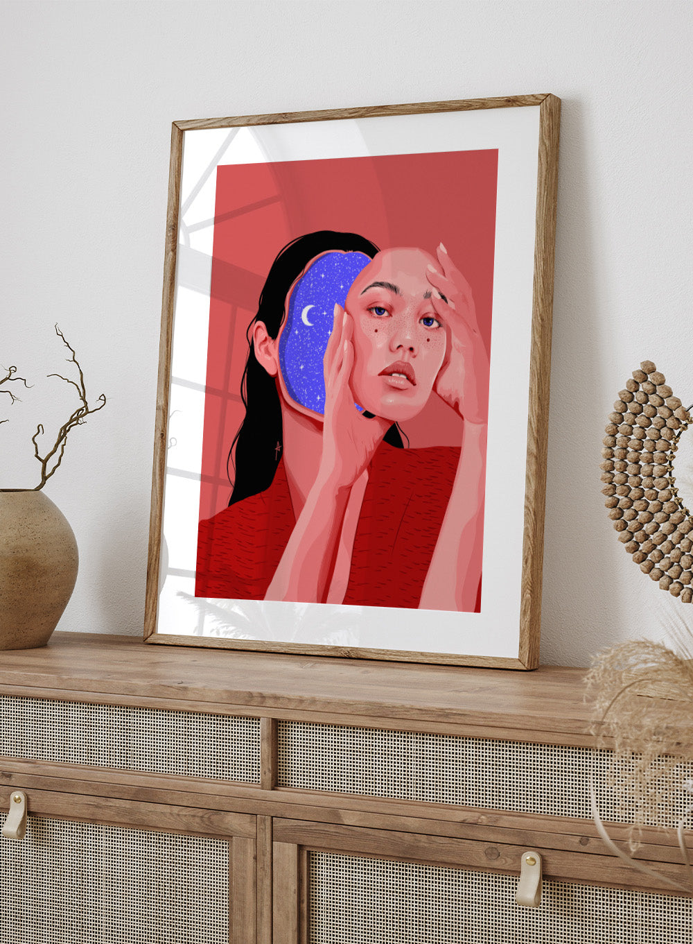 Illustration of a person with a starry night design, on a red background. Des Astres by AnA Ariane is a surreal portrait art print featuring a woman with a starry cosmic interior. Modern figurative wall poster.