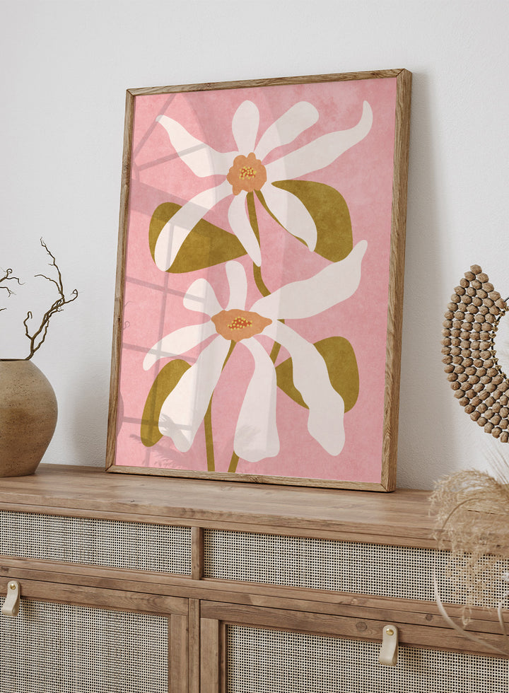 Two white flowers with green stems on a pink background. Abstract Flowers I by Raissa Oltmanns is a modern floral art print featuring white blooms on pink in contemporary botanical wall poster style.