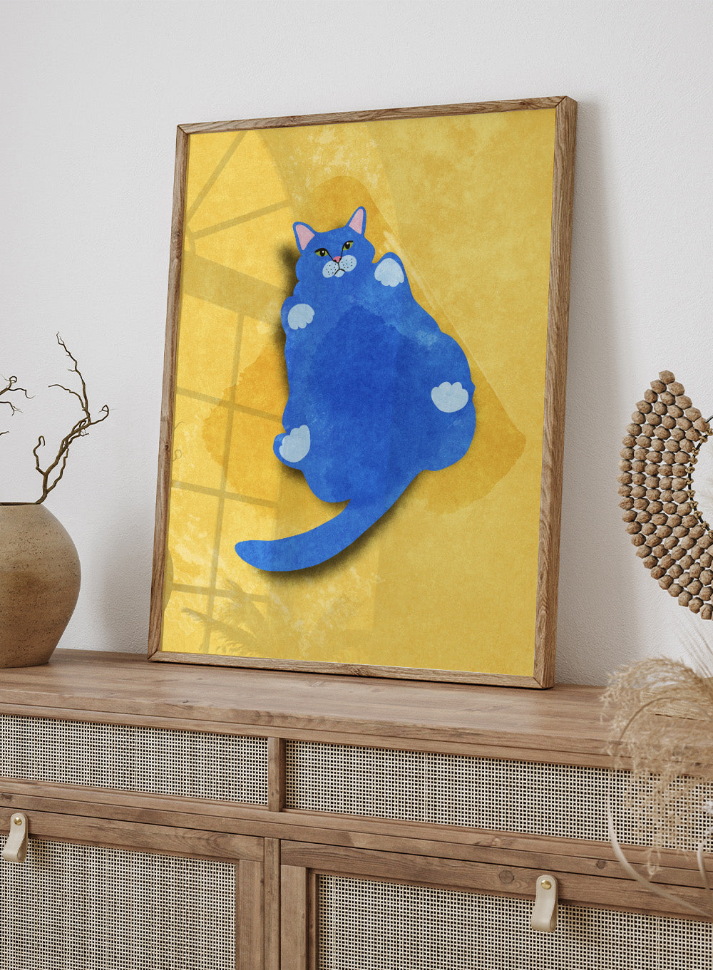 Blue cat illustration on a yellow textured background. Fat Cat by Raissa Oltmanns is a modern cat art print featuring a bold blue feline on yellow background in contemporary wall poster style.