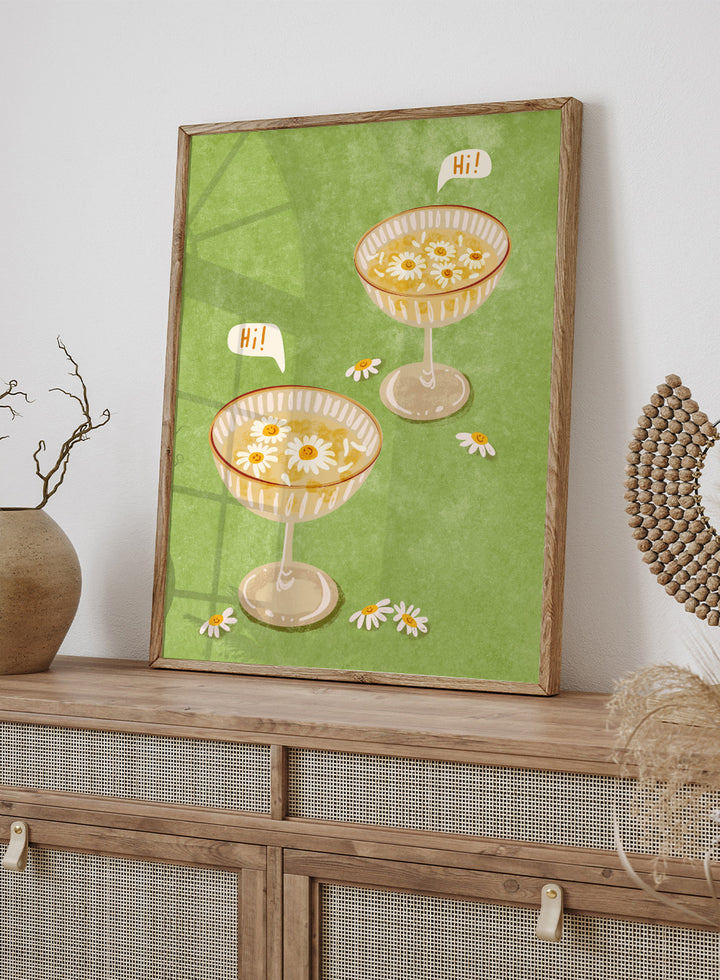 Illustration of two cocktail glasses with daisies on a green background. Hi by Raissa Oltmanns is a modern cocktail art print featuring smiling daisy drinks in playful contemporary wall poster style.