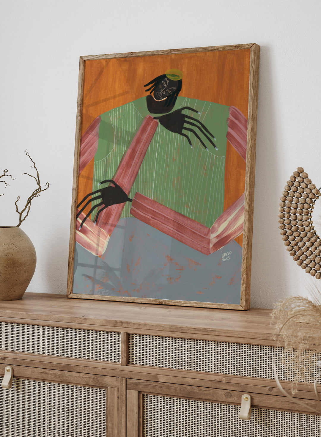 Artistic depiction of a person with spider-like hands and feet against a wooden background. No Place to Be by Studio IMO (Ibi Meier-Oruitemeka) is a modern figurative art print with a seated figure, bold color, and contemporary portrait wall poster design.