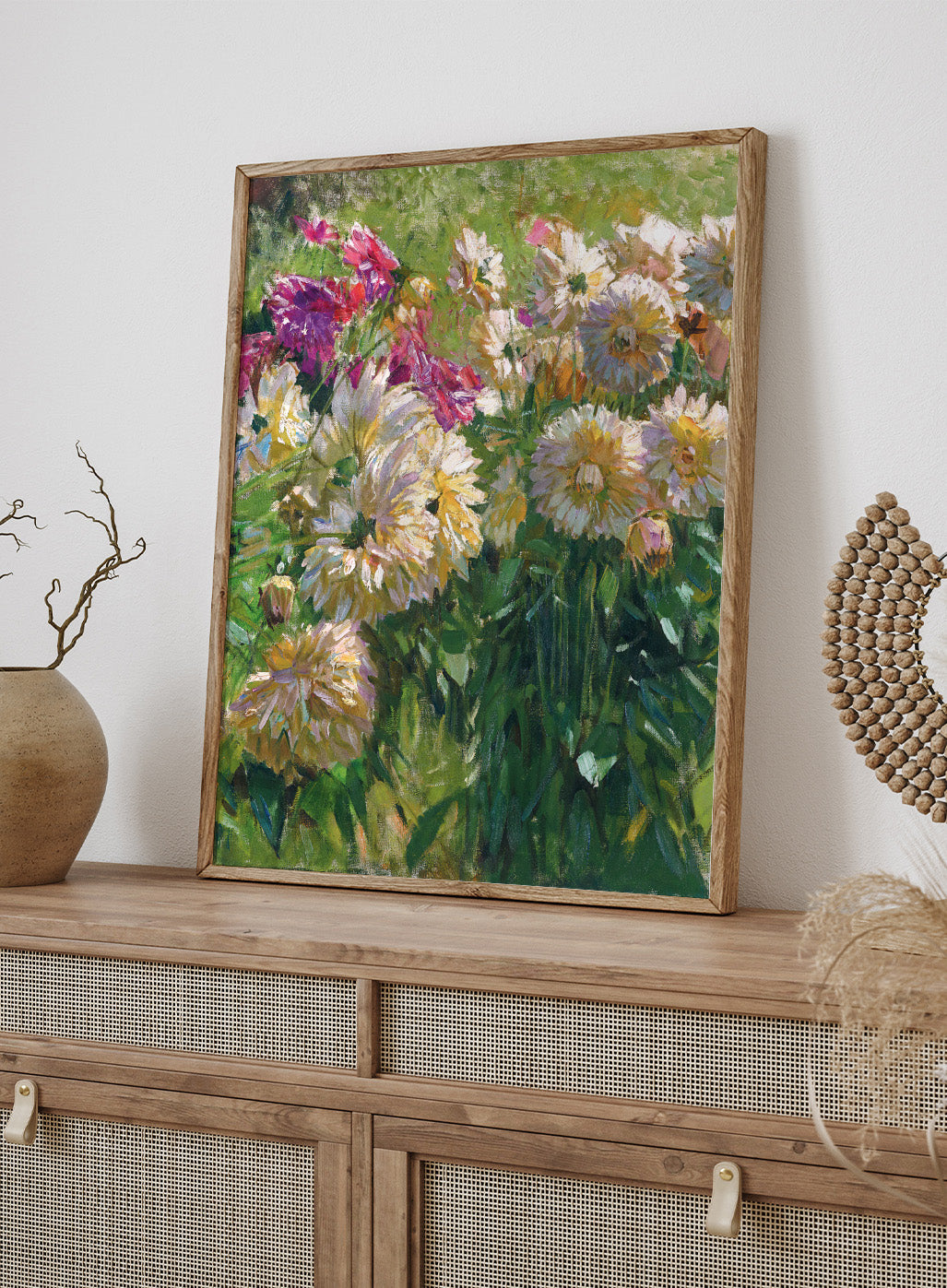 In “Dahlias” vintage art print, Carl Moll captures a vibrant cluster of garden flowers with bold brushwork and luminous color. Ivory, peach, and plum-colored dahlias fill the canvas, their petals nestled among dense green stems. This antique botanical poster is ideal for farmhouse and cottagecore interiors.