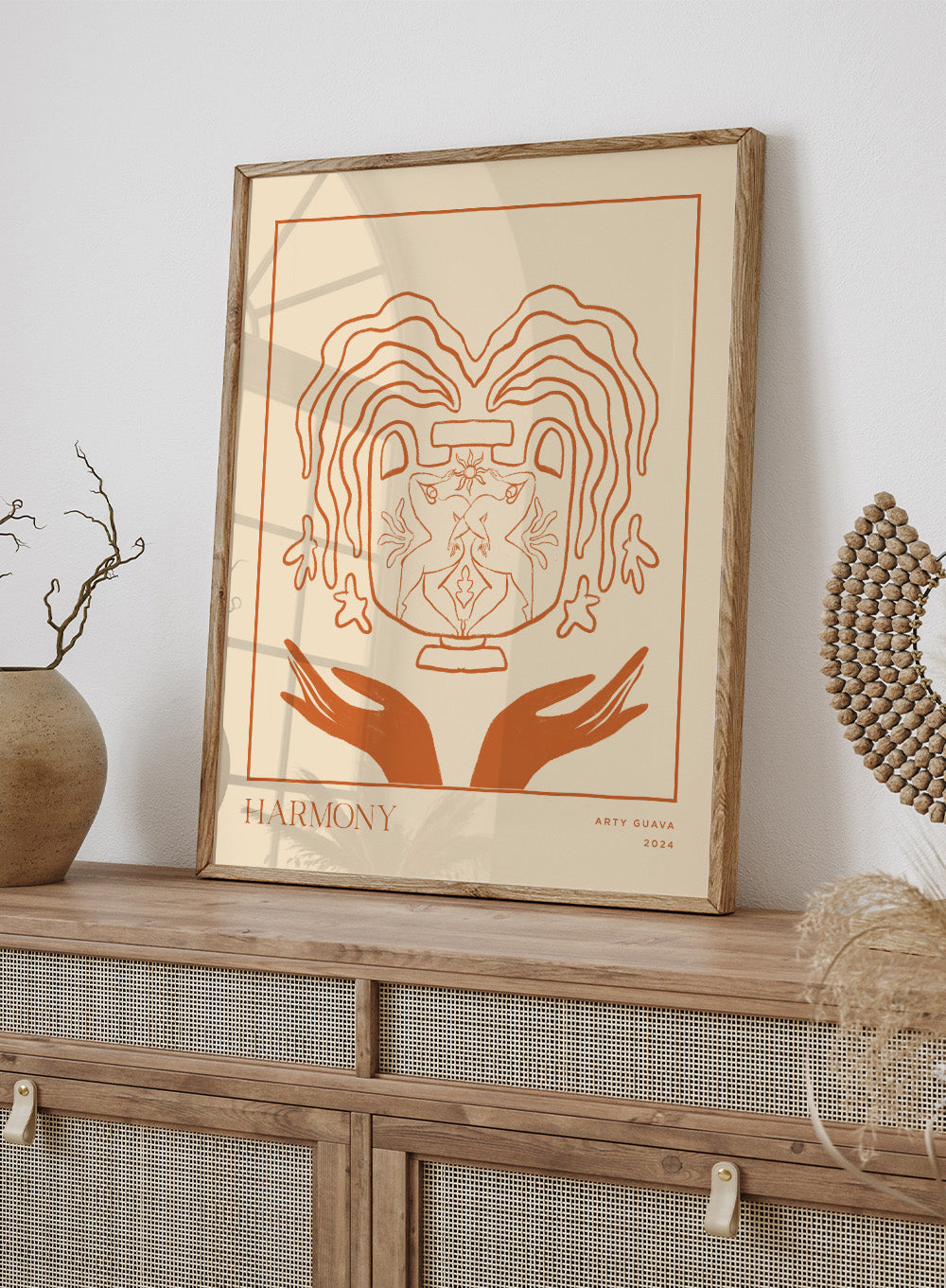 Artistic illustration of a heart with hands holding it, titled 'Harmony' by Arty Guava 2024. Harmony by Arty Guava is a minimalist vessel art print with terracotta linework, mirrored figures, and symbolic calm. Officially licensed wall poster.