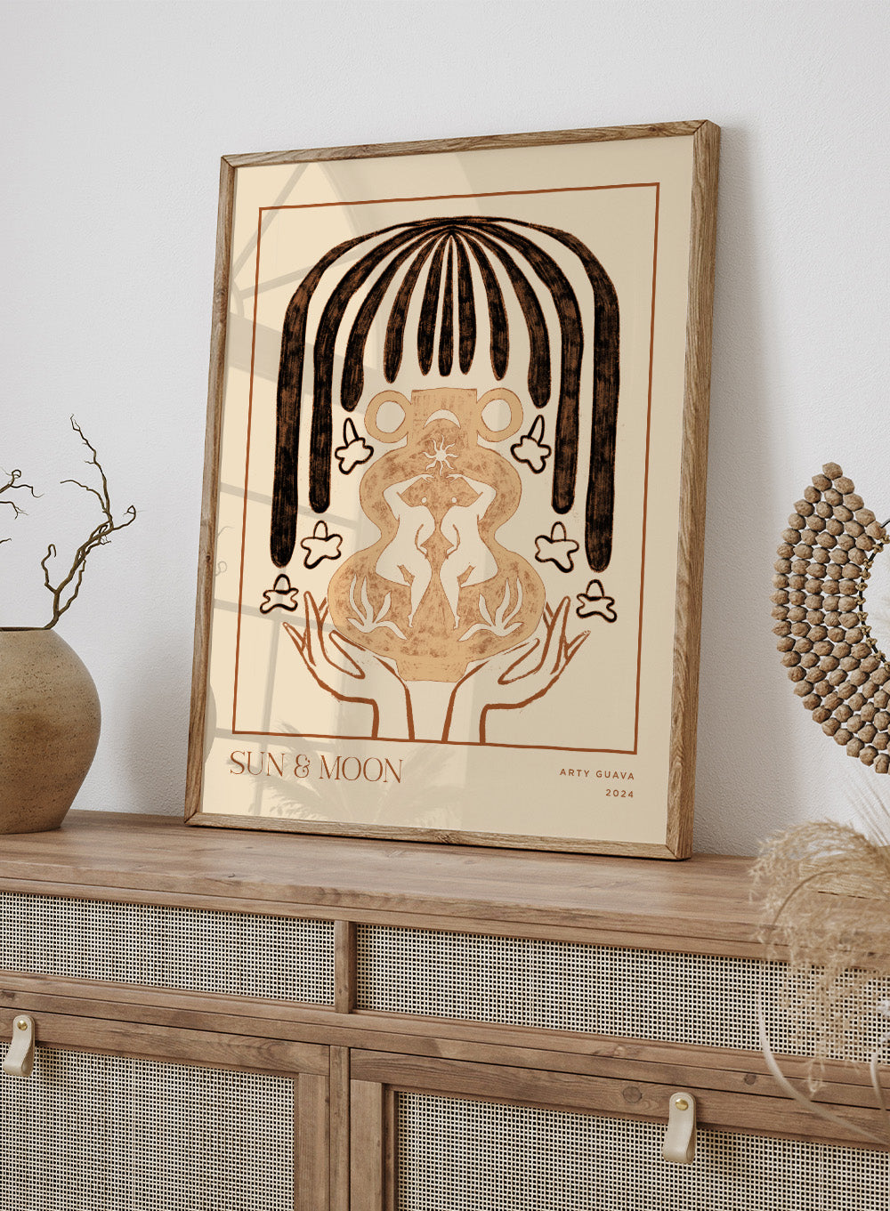 Artistic illustration of hands holding a symbol with 'Sun & Moon' text on a beige background. Vessel Collection: Sun & Moon by Arty Guava art print, modern vase wall poster with moon symbolism, contemporary minimalist line artwork.