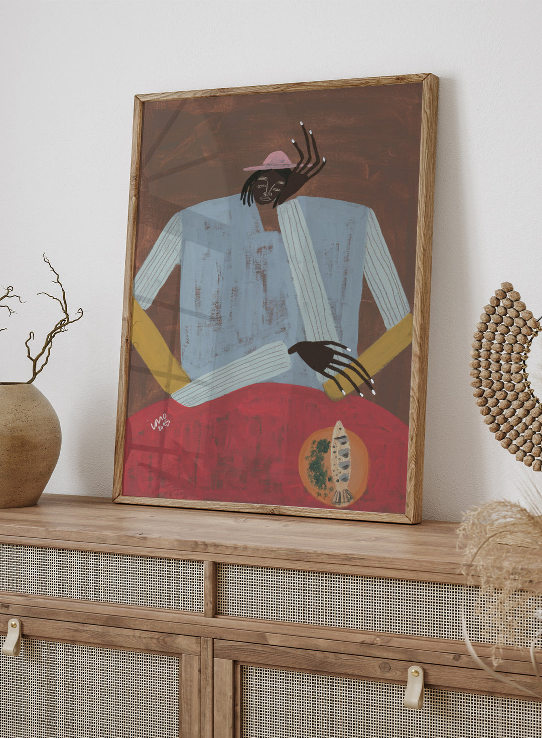 Artistic depiction of a person wearing a hat and sweater with a red background. Clear My Head by Studio IMO (Ibi Meier-Oruitemeka) is a modern figurative art print with a seated figure and contemporary portrait wall poster design.