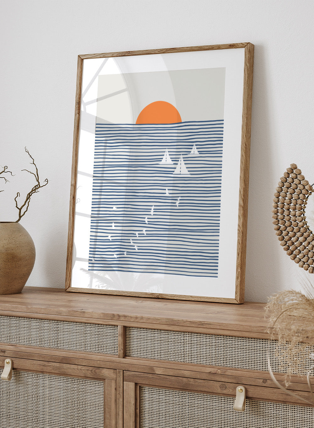 Three White Sails art print by Little Dean. Contemporary coastal wall art with sailboats, birds, striped ocean lines, orange sun, modern illustration poster design.