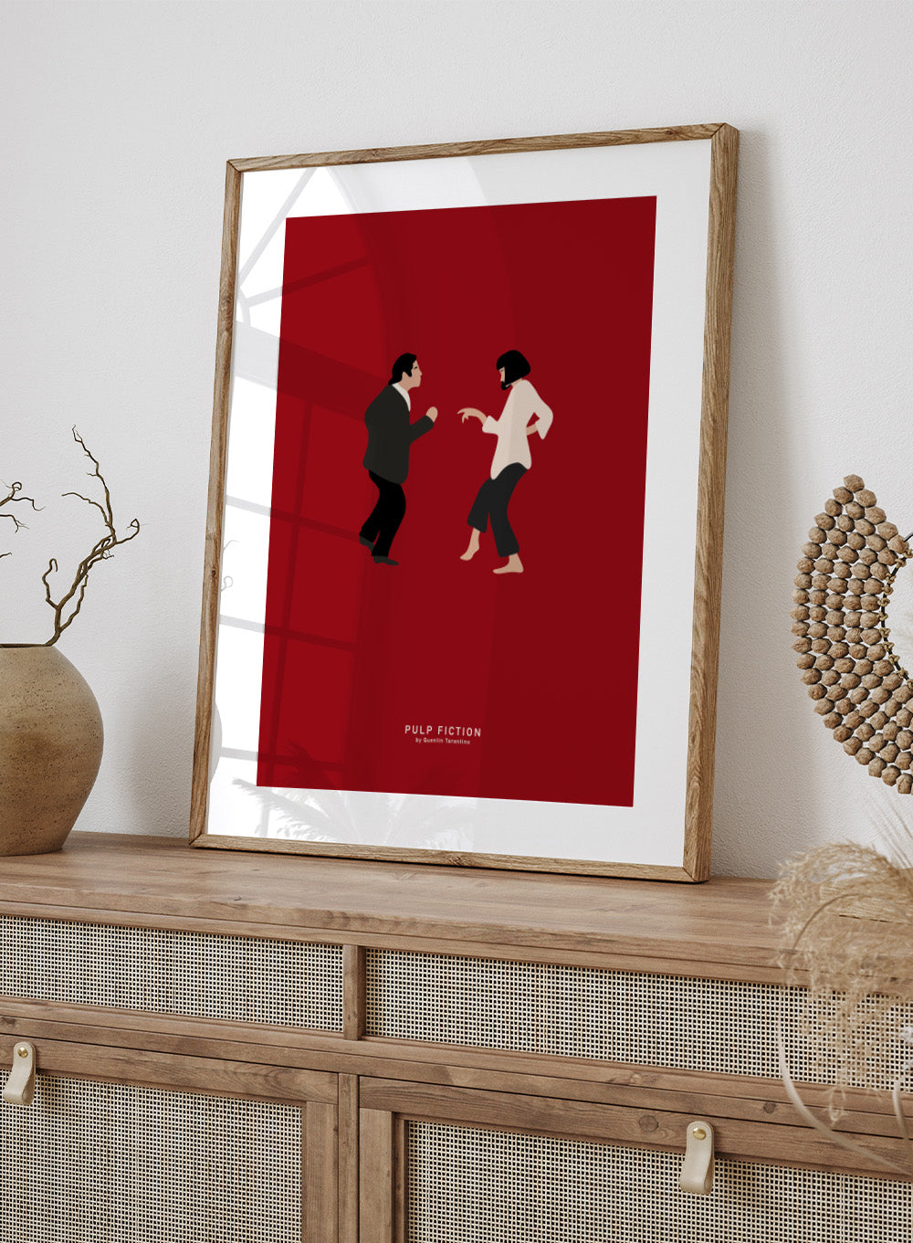 Minimalist illustration of two characters facing each other on a red background with 'Pulp Fiction' text. Minimalist dance illustration of two figures on a red background by Anne-Marie Volfova. Officially licensed modern art print with optional framing.