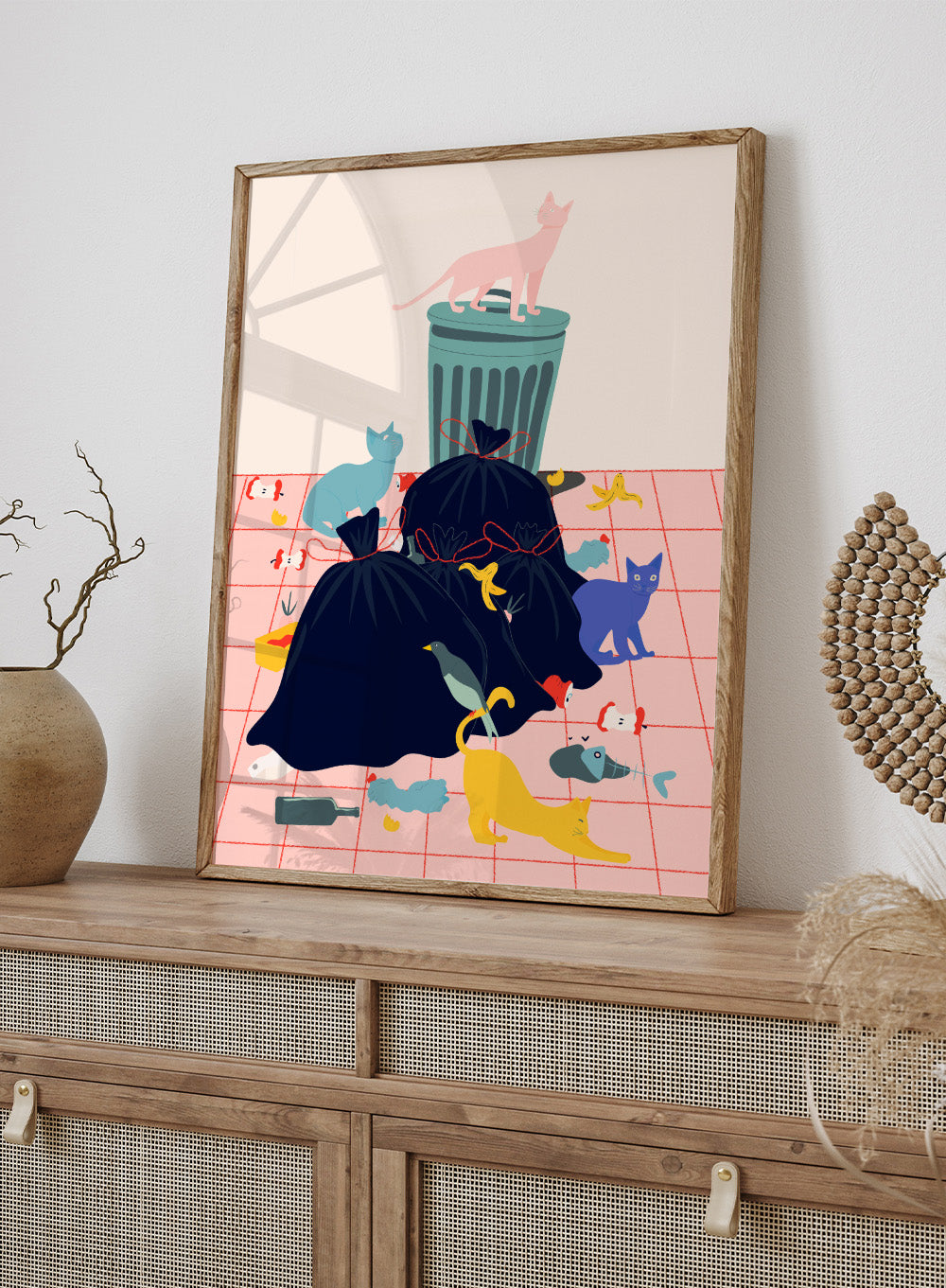 Illustration of a trash can and cats on a pink grid background. Cats by Jota de Jai is a funny modern wall art print featuring colorful cats taking over a messy room. Officially licensed fine art poster with optional wood frame.