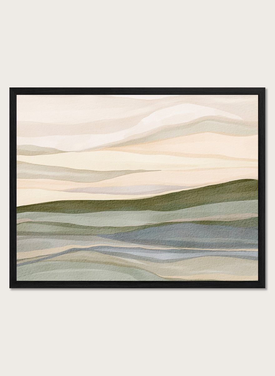 Framed abstract landscape wall art featuring layered hills and mountains in soft beige, cream, sage green, and muted blue tones. Shop Serene Rolling Hills by Nikita Jariwala, an abstract landscape wall art print poster featuring layered hills, distant mountains, and soft green tones.