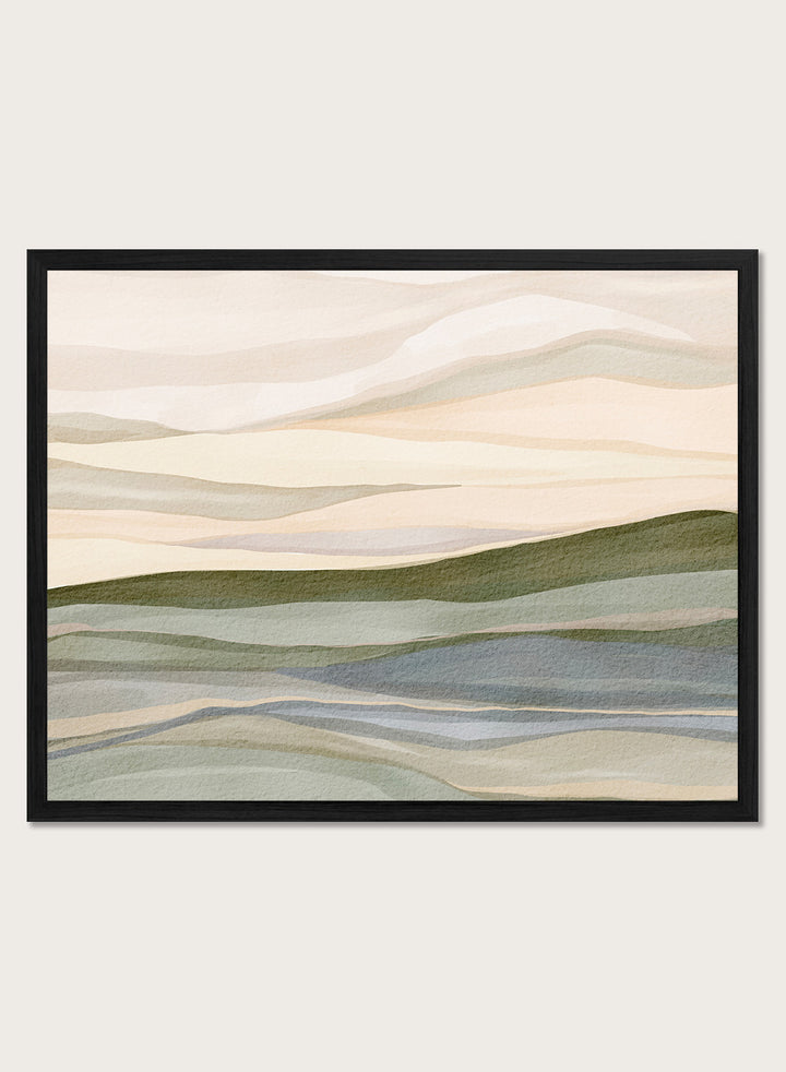 Framed abstract landscape wall art featuring layered hills and mountains in soft beige, cream, sage green, and muted blue tones. Shop Serene Rolling Hills by Nikita Jariwala, an abstract landscape wall art print poster featuring layered hills, distant mountains, and soft green tones.