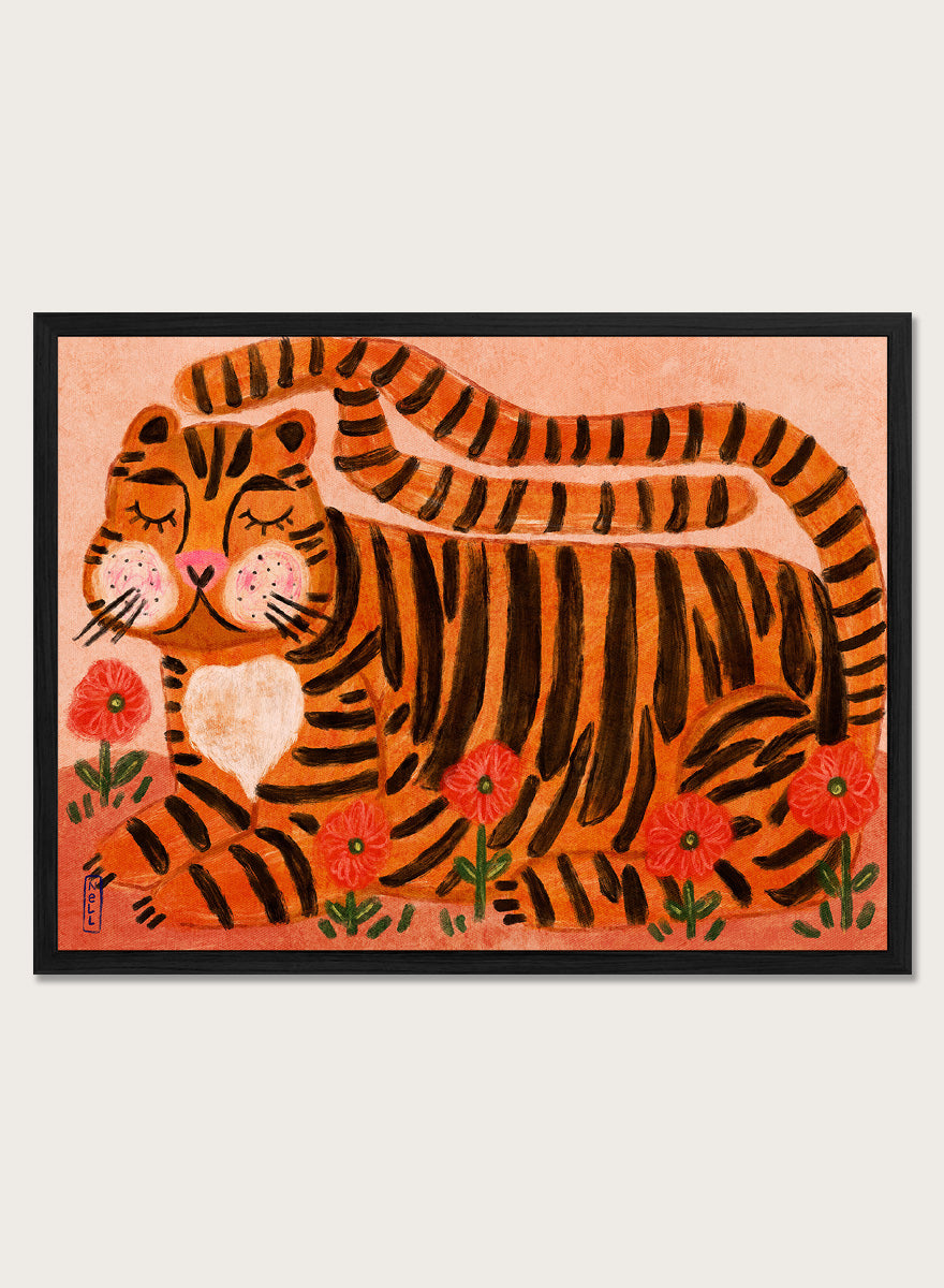A framed art print featuring a stylized orange and black striped tiger lying among red flowers on a peach background. Playful tiger animal art print by Dirkie Nell with bold orange stripes, red poppies, and a warm peach background. Shop this cheerful piece today.