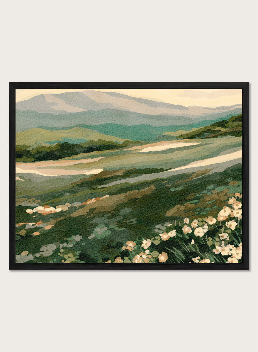 Shop Wildflower Mountain Landscape by Nikita Jariwala, a mountain wall art print with rolling green hills, cream wildflowers, and soft sage and blue-gray tones.