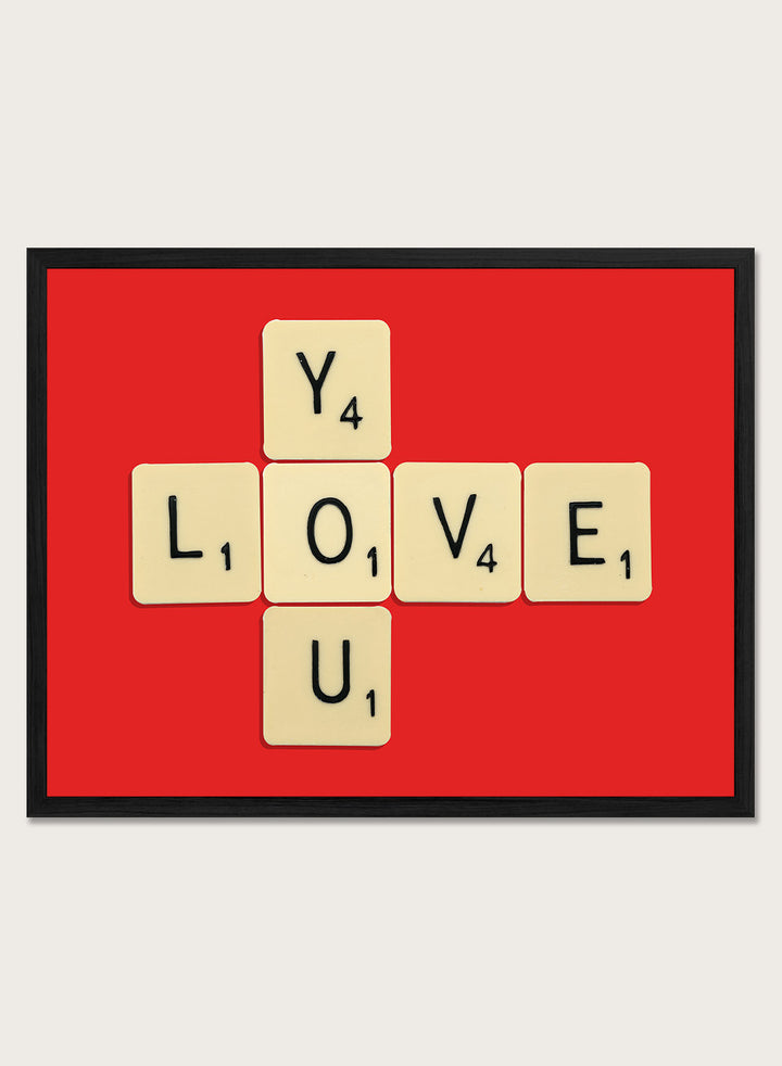 Scrabble tiles spelling LOVE YOU on a red background. Love You by Florent Bodart is a playful crossword-style art print featuring letter tiles spelling LOVE YOU on a red background. Retro typography wall poster with optional framing.
