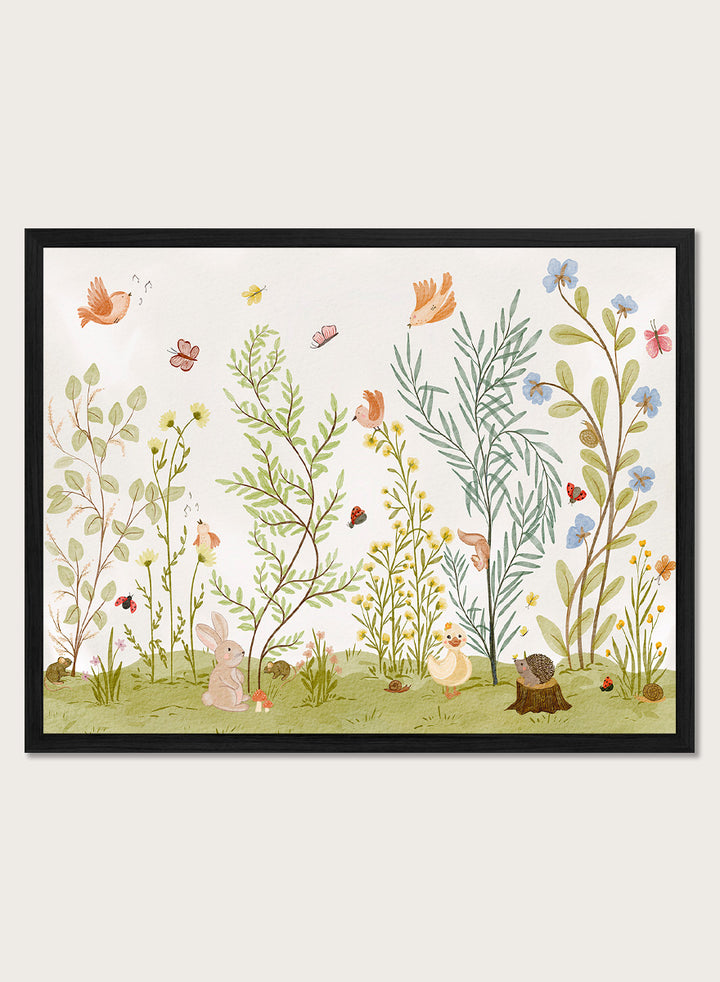 A framed art print featuring a whimsical, watercolor-style illustration of a garden with birds, butterflies, flowers, rabbits, and small animals on a light cream background. Shop Woodland Animal Friends by Nikita Jariwala, a woodland animal wall art print poster with rabbit, duck, hedgehog, butterflies, flowers, and green tones.