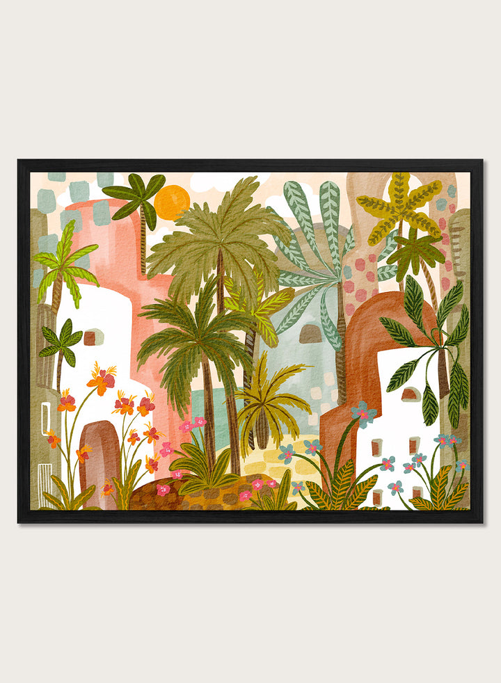 A framed art print featuring a whimsical, retro-style illustration of a tropical city with palm trees, colorful buildings, and flowers. Shop Vibrant Tropical Village by Nikita Jariwala, a tropical wall art print poster with palm trees, colorful village architecture, botanical scenery, and green tones.