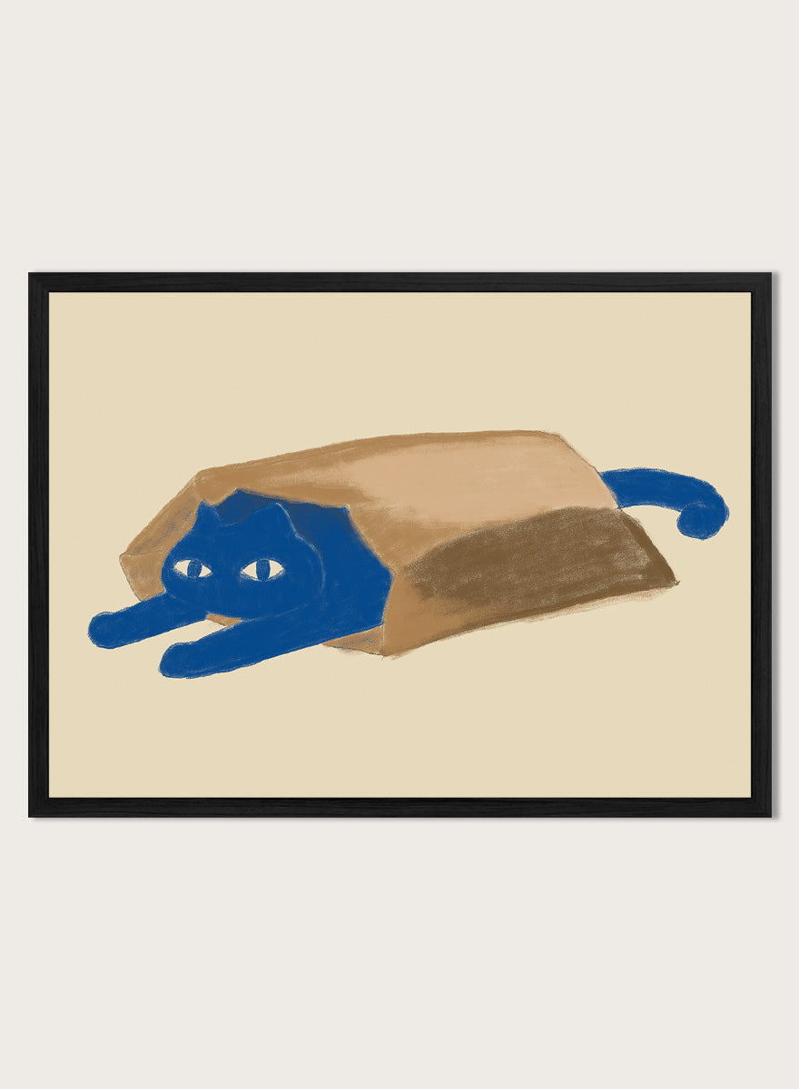 A framed art print featuring a whimsical illustration of a blue cat peeking out from inside a brown paper bag, set against a warm beige background. Blue Cat In A Bag by The Art Concept is a playful minimalist cat art print featuring a blue cat tucked inside a paper bag on a warm cream background.