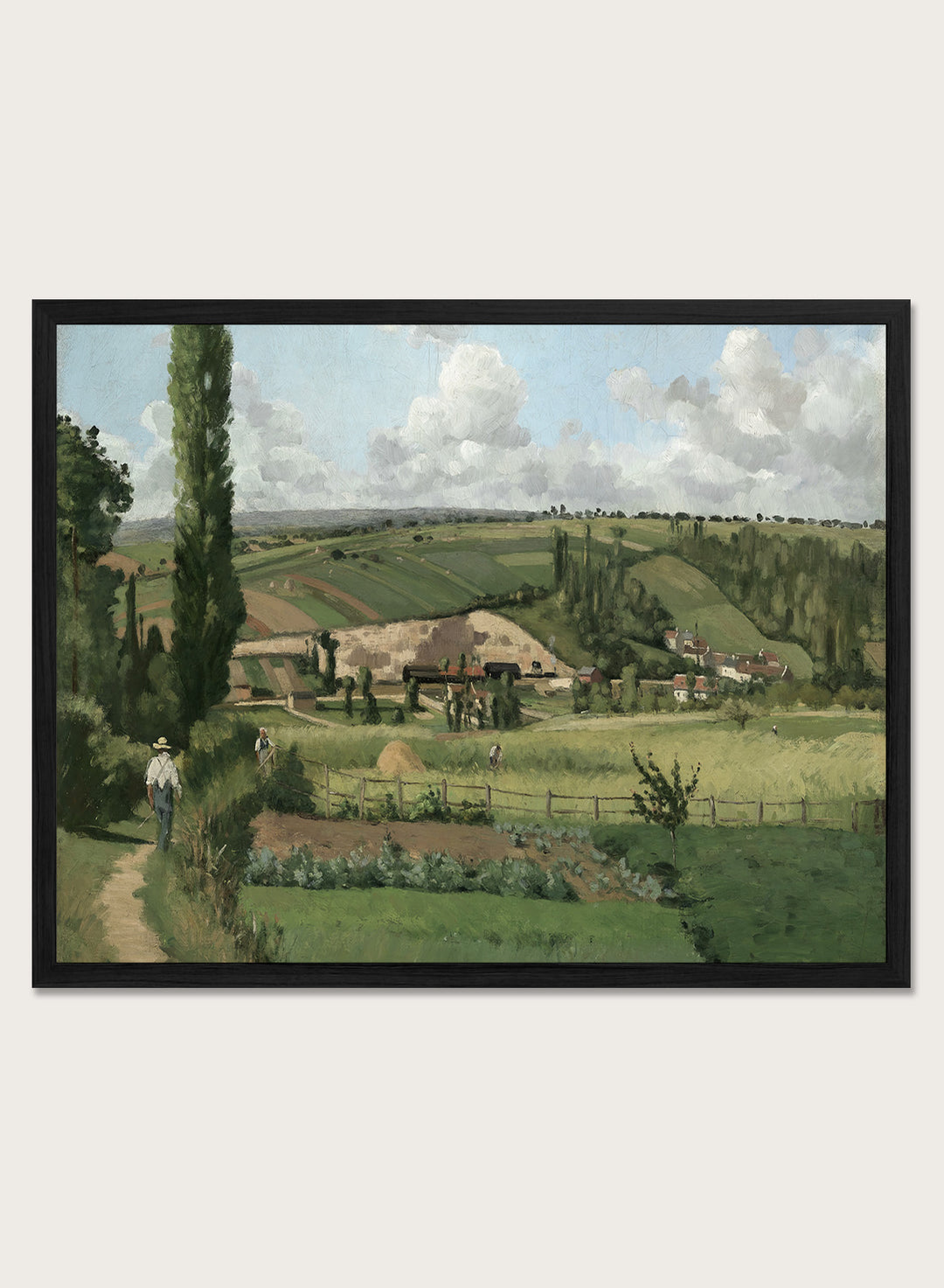 A framed landscape painting depicting a green countryside scene with rolling hills, trees, a path, small buildings, and a cloudy sky. Landscape at Les Pâtis, Pontoise by Camille Pissarro is a vintage French landscape print featuring green fields, farm workers, rolling hills, and a summer sky.