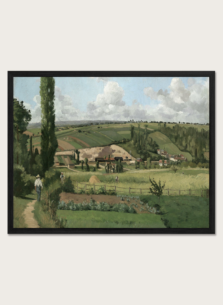 A framed landscape painting depicting a green countryside scene with rolling hills, trees, a path, small buildings, and a cloudy sky. Landscape at Les Pâtis, Pontoise by Camille Pissarro is a vintage French landscape print featuring green fields, farm workers, rolling hills, and a summer sky.