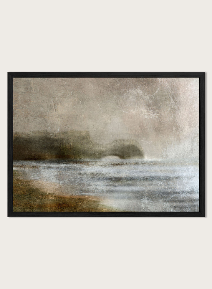 A framed abstract landscape art print featuring textured waves and a distant rocky shoreline in muted beige, gray, brown, and white tones. Shop Dusk by Dan Hobday, a moody landscape art print featuring misty water, low hills, earthy neutral toned nature, and soft layered brush texture.