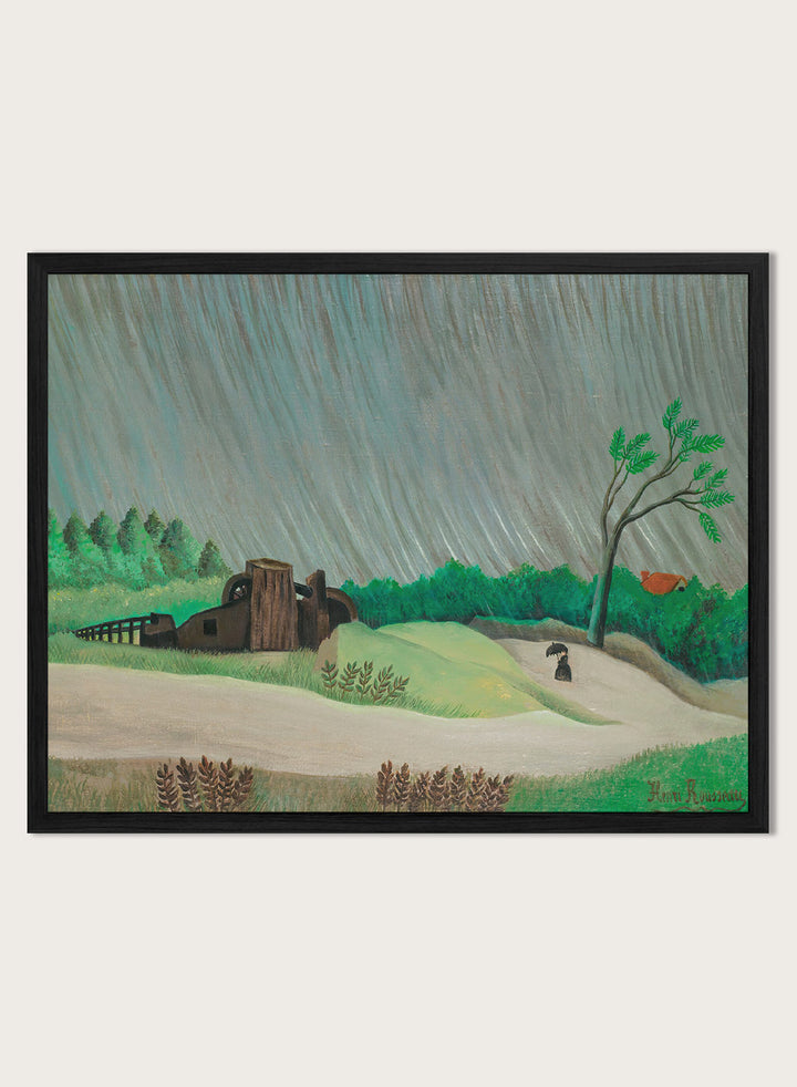 A framed landscape painting depicting a rainy day in a green valley with a small house, a lone tree, and a figure holding an umbrella. A Rainy Morning by Henri Rousseau is a vintage landscape art print featuring a rainy country road, umbrella figure, green fields, trees, and a rustic watermill.