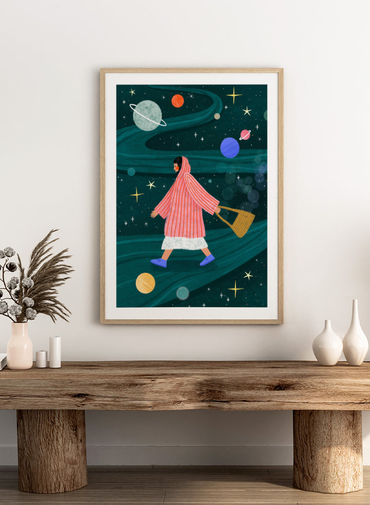 Shop Dreamy Space Walk by Bea Müller, a figurative wall art print poster featuring a woman walking through a whimsical outer space landscape in deep green tones.