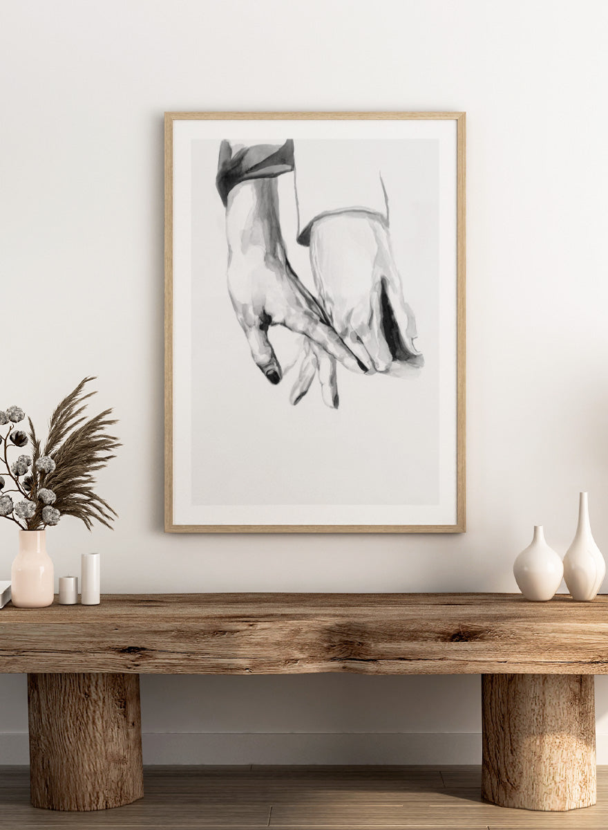 Shop Gentle Hands Connected by Sophia Novosel, a minimalist black and white wall art print poster featuring two hands touching in a soft, intimate gesture.