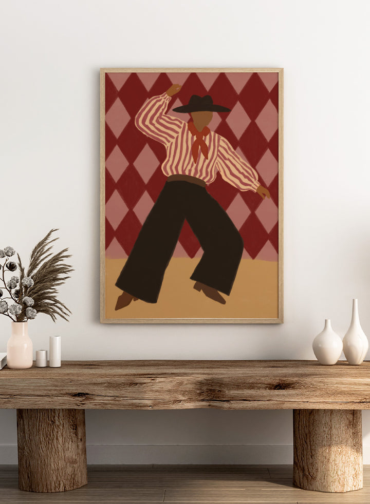 A stylized illustration of a person in a cowboy hat, striped shirt, and dark pants dancing against a red and pink diamond-patterned background. Retro Dance Character by The Art Concept art print with a dancing figure, striped shirt, red scarf, harlequin background, and retro color palette.