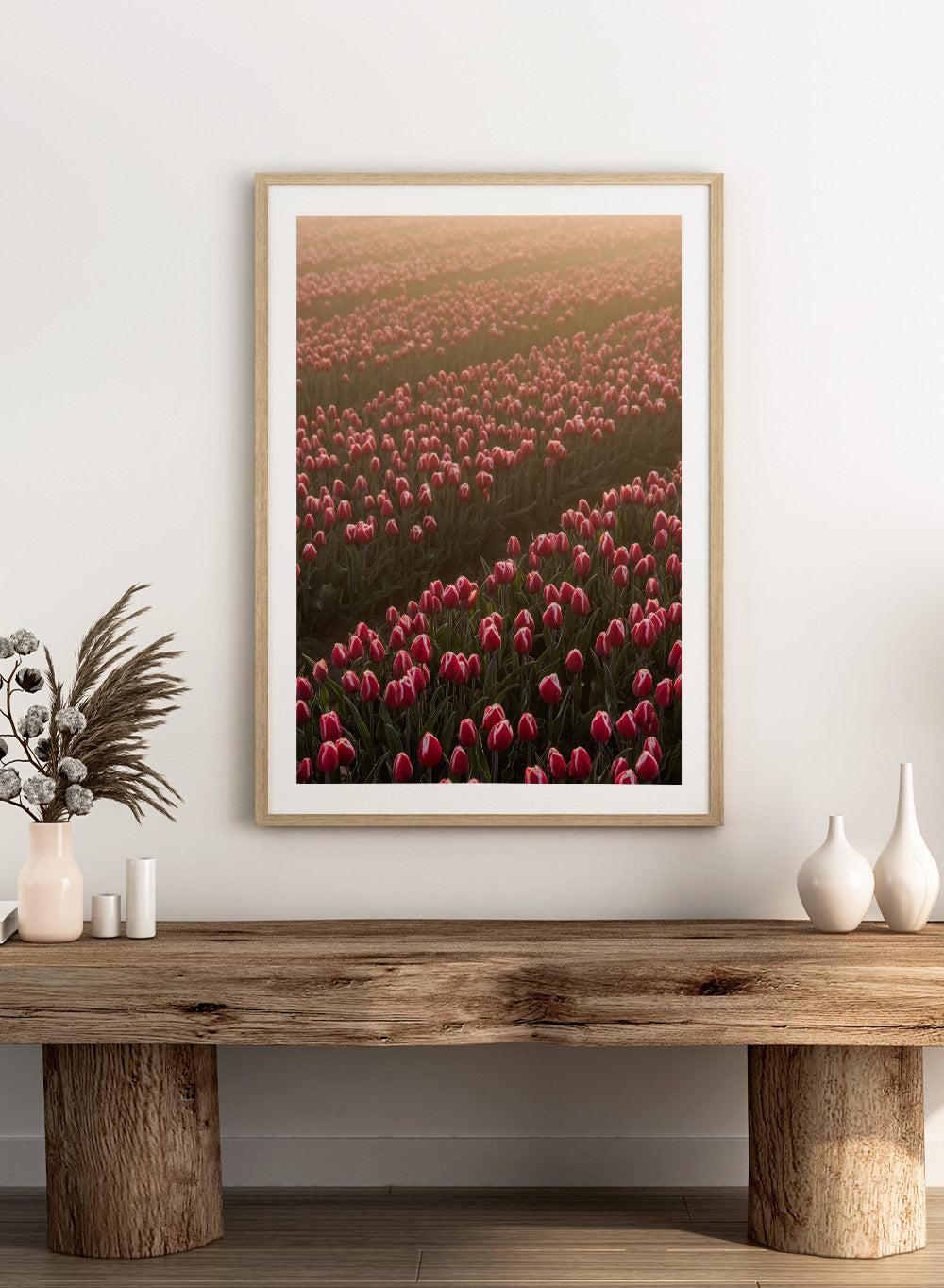 Field of pink tulips with a soft glow, likely from sunset or sunrise. Field of Flowers Art Print by Mareike Böhmer. Floral wall art photography featuring pink tulips. Officially licensed fine art print by German photographer Mareike Böhmer.